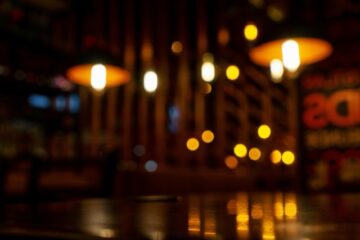 Blurred background in modern cafe, bokeh lights.