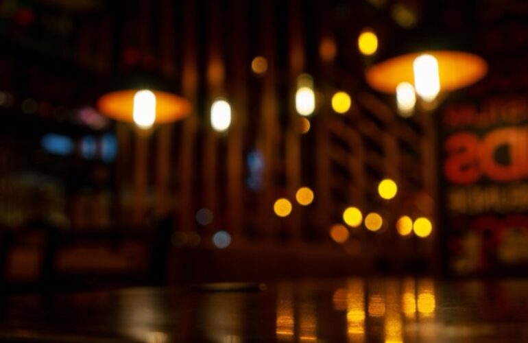 Blurred background in modern cafe, bokeh lights.